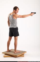 Man Adult Athletic White Fighting with gun Standing poses Sportswear