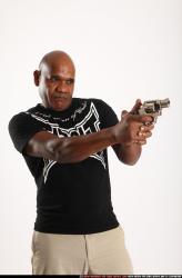 Man Old Chubby Black Fighting with gun Standing poses Casual