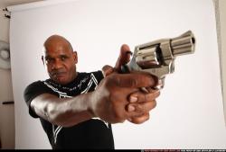 Man Old Chubby Black Fighting with gun Standing poses Casual