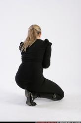 Woman Adult Athletic White Neutral Kneeling poses Casual