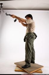 Man Adult Average Fighting with submachine gun Standing poses Army Asian