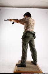 Man Adult Average Fighting with submachine gun Standing poses Army Asian