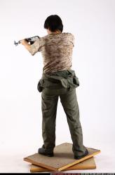 Man Adult Average Fighting with submachine gun Standing poses Army Asian