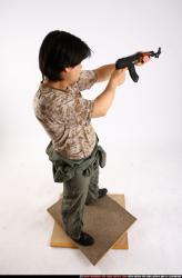 Man Adult Average Fighting with submachine gun Standing poses Army Asian