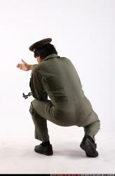 Man Adult Average Fighting with submachine gun Kneeling poses Army Asian