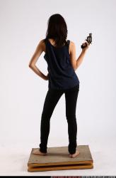 Woman Young Athletic Fighting with gun Standing poses Casual Asian