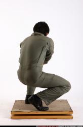 Man Adult Average Fighting with gun Kneeling poses Army Asian