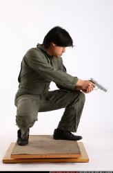 Man Adult Average Fighting with gun Kneeling poses Army Asian