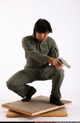 Man Adult Average Fighting with gun Kneeling poses Army Asian