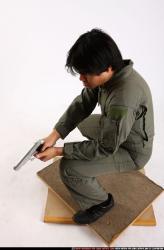 Man Adult Average Fighting with gun Kneeling poses Army Asian