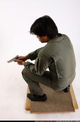 Man Adult Average Fighting with gun Kneeling poses Army Asian