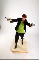 Woman Adult Average White Fighting with gun Standing poses Business