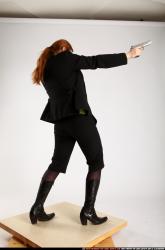 Woman Adult Average White Fighting with gun Standing poses Business