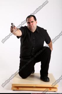 2010 08 SLAVOJ MOBSTER KNEELING AIMING PISTOL 00