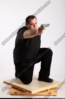 2010 08 SLAVOJ MOBSTER KNEELING AIMING PISTOL 01