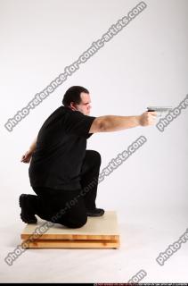 2010 08 SLAVOJ MOBSTER KNEELING AIMING PISTOL 02