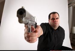 Slavoj_mobster-kneeling-aiming-pistol