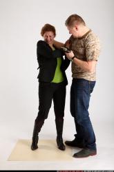 Man & Woman Adult Average White Fighting with gun Standing poses Casual