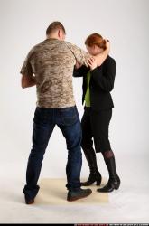 Man & Woman Adult Average White Fighting with gun Standing poses Casual