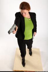 Woman Adult Average White Fighting with gun Standing poses Business