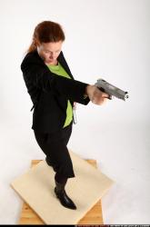 Woman Adult Average White Fighting with gun Standing poses Business