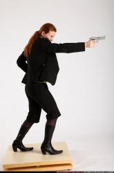 Woman Adult Average White Fighting with gun Standing poses Business