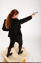 Woman Adult Average White Fighting with gun Standing poses Business