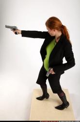 Woman Adult Average White Fighting with gun Standing poses Business