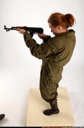 Woman Adult Average White Fighting with submachine gun Standing poses Army