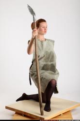 Woman Adult Average White Fighting with spear Kneeling poses Army
