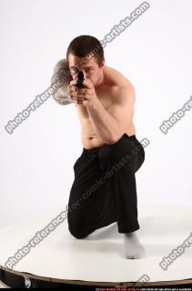 alex-kneeling-aiming-pistol