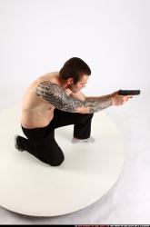 Man Adult Athletic White Fighting with gun Kneeling poses Pants