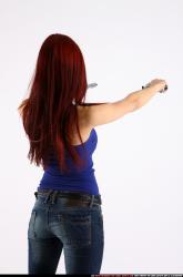 Woman Young Athletic White Fighting with gun Standing poses Casual