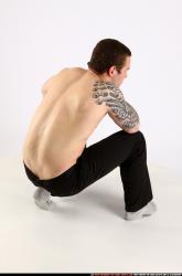 Man Adult Athletic White Fighting with gun Kneeling poses Pants