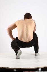 Man Adult Athletic White Fighting with gun Kneeling poses Pants