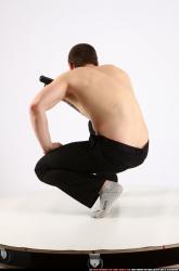 Man Adult Athletic White Fighting with gun Kneeling poses Pants