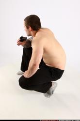 Man Adult Athletic White Fighting with gun Kneeling poses Pants