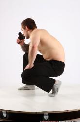 Man Adult Athletic White Fighting with gun Kneeling poses Pants