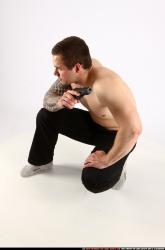 Man Adult Athletic White Fighting with gun Kneeling poses Pants