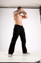 Man Adult Athletic White Fighting with knife Standing poses Pants