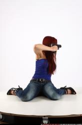 Woman Young Athletic White Fighting with gun Kneeling poses Casual