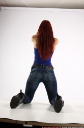 Woman Young Athletic White Fighting with gun Kneeling poses Casual