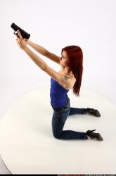 Woman Young Athletic White Fighting with gun Kneeling poses Casual