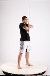 Man Adult Athletic White Fighting with sword Standing poses Sportswear