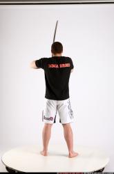 Man Adult Athletic White Fighting with sword Standing poses Sportswear