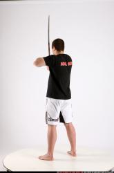 Man Adult Athletic White Fighting with sword Standing poses Sportswear