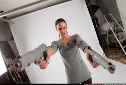 Woman Adult Athletic White Fighting with gun Standing poses Casual