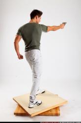 Man Adult Muscular White Fighting with gun Standing poses Casual