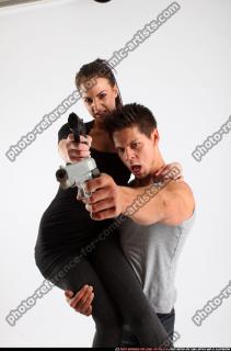 couple4-holding-shooting-pistols