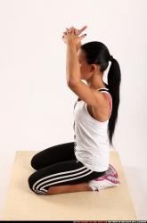 Woman Young Athletic Fitness poses Sitting poses Sportswear Latino